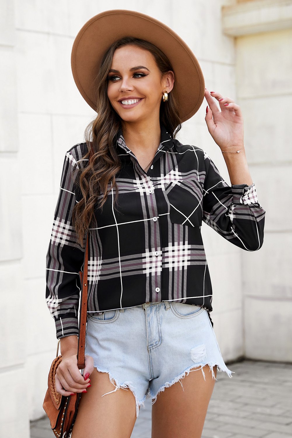 A stylish plaid button shirt in black, showcasing its classic design and comfortable fabric, perfect for various occasions.