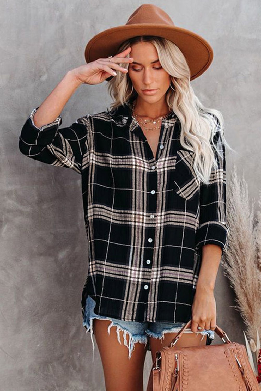 A stylish plaid button shirt in black, showcasing its classic design and comfortable fabric, perfect for various occasions.