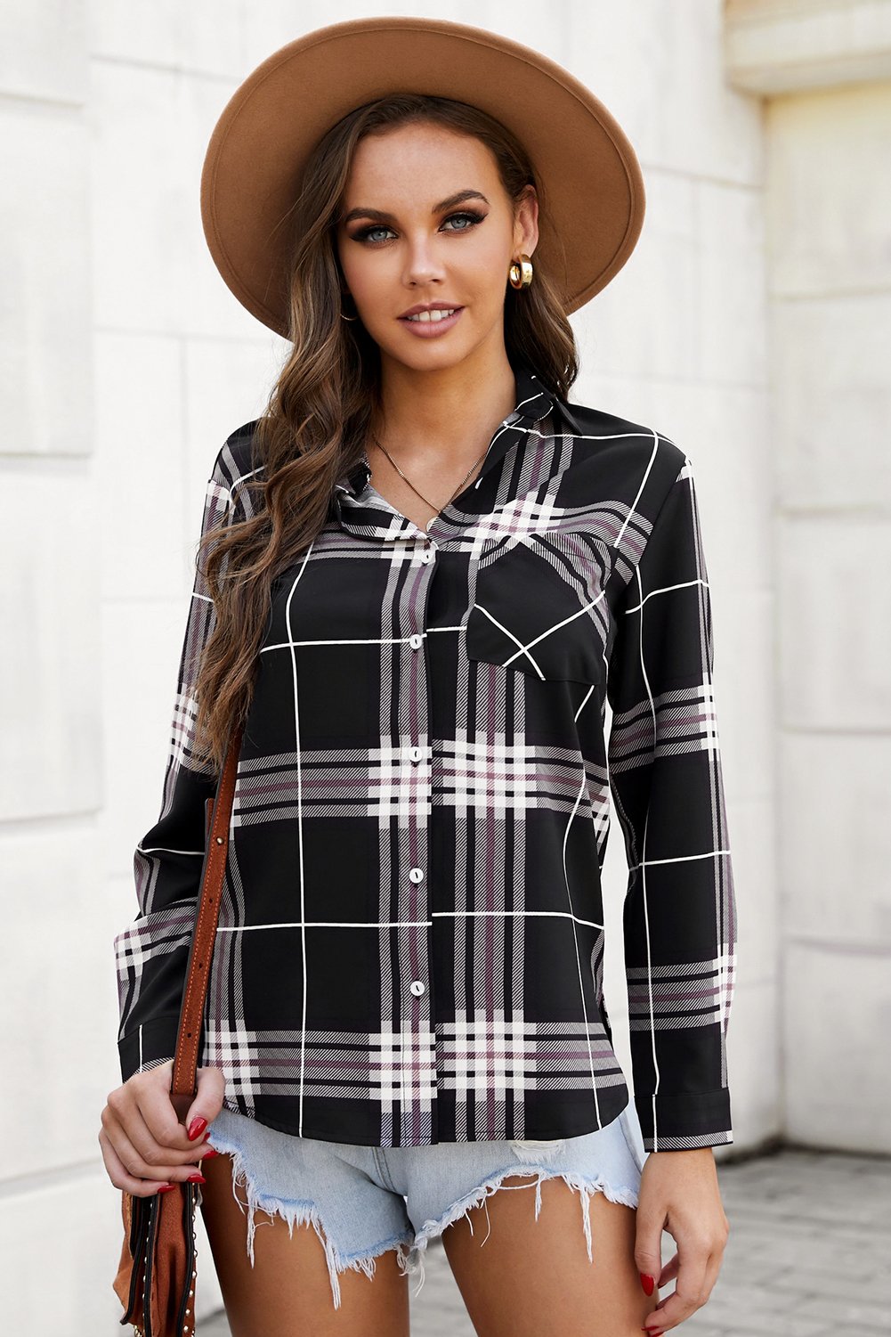 A stylish plaid button shirt in black, showcasing its classic design and comfortable fabric, perfect for various occasions.