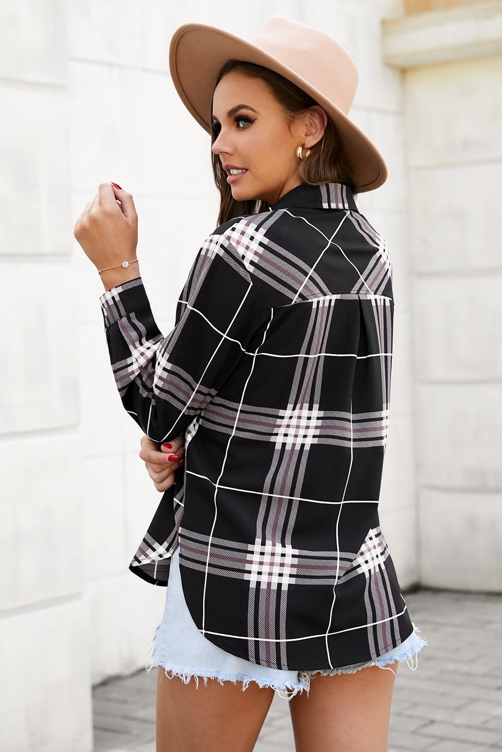 A stylish plaid button shirt in black, showcasing its classic design and comfortable fabric, perfect for various occasions.