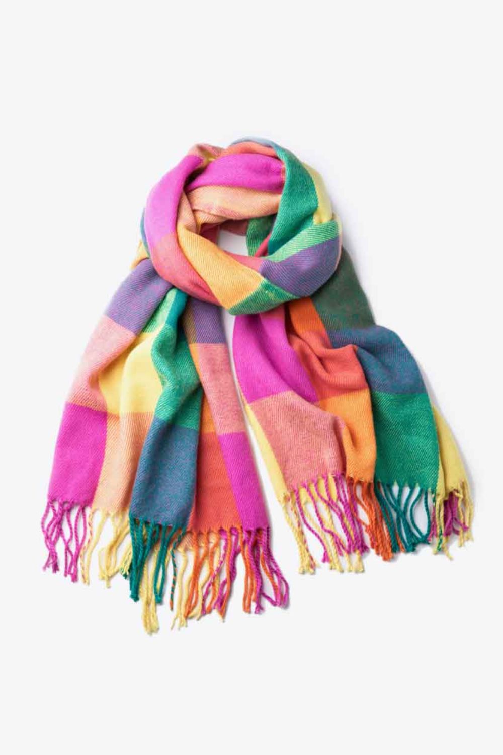 A stylish plaid fringe hem scarf laid flat, showcasing its vibrant colors and soft texture.