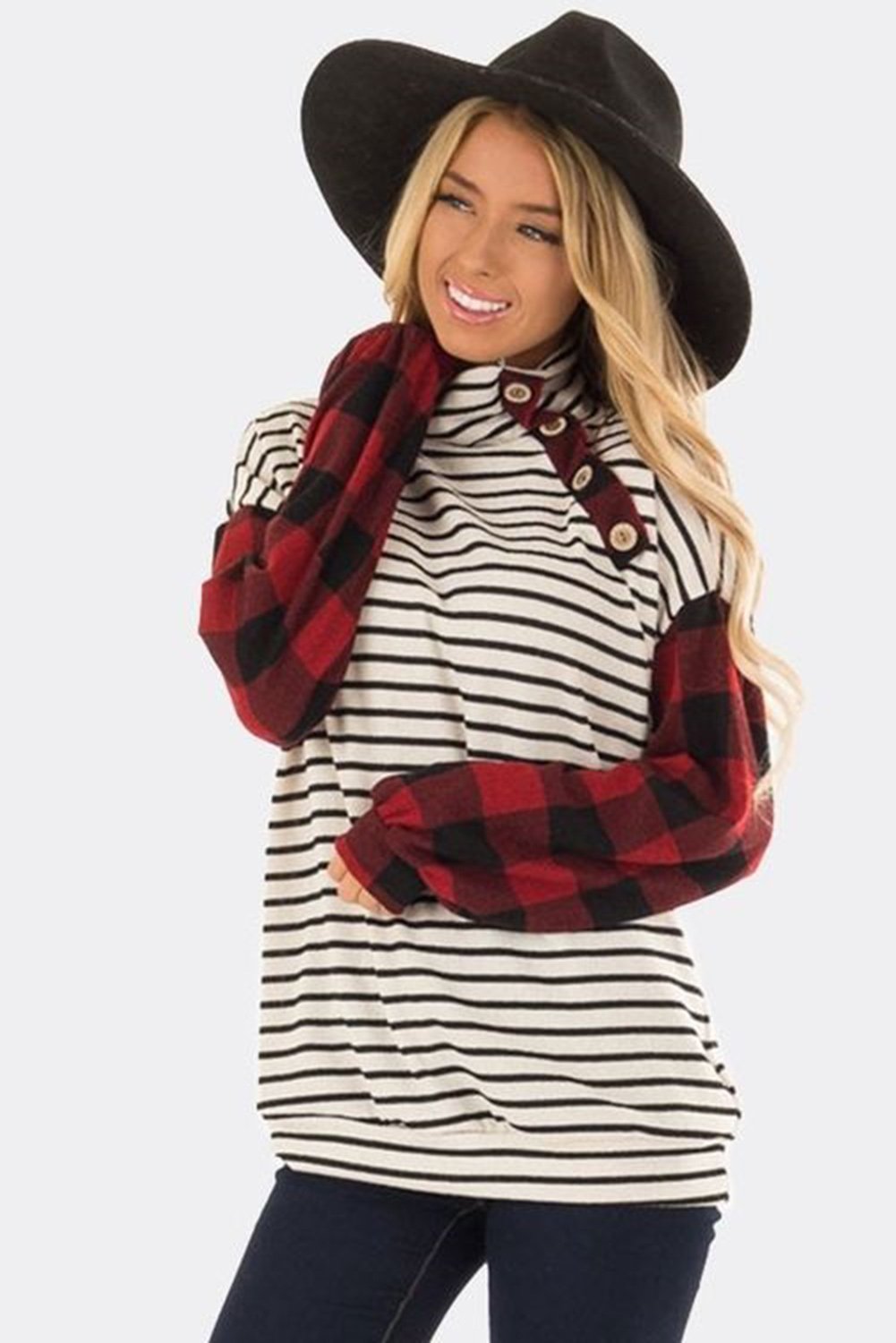 A stylish plaid patchwork striped long sleeve top featuring a high neck, irregular button detail, and retro checkered lantern sleeves.