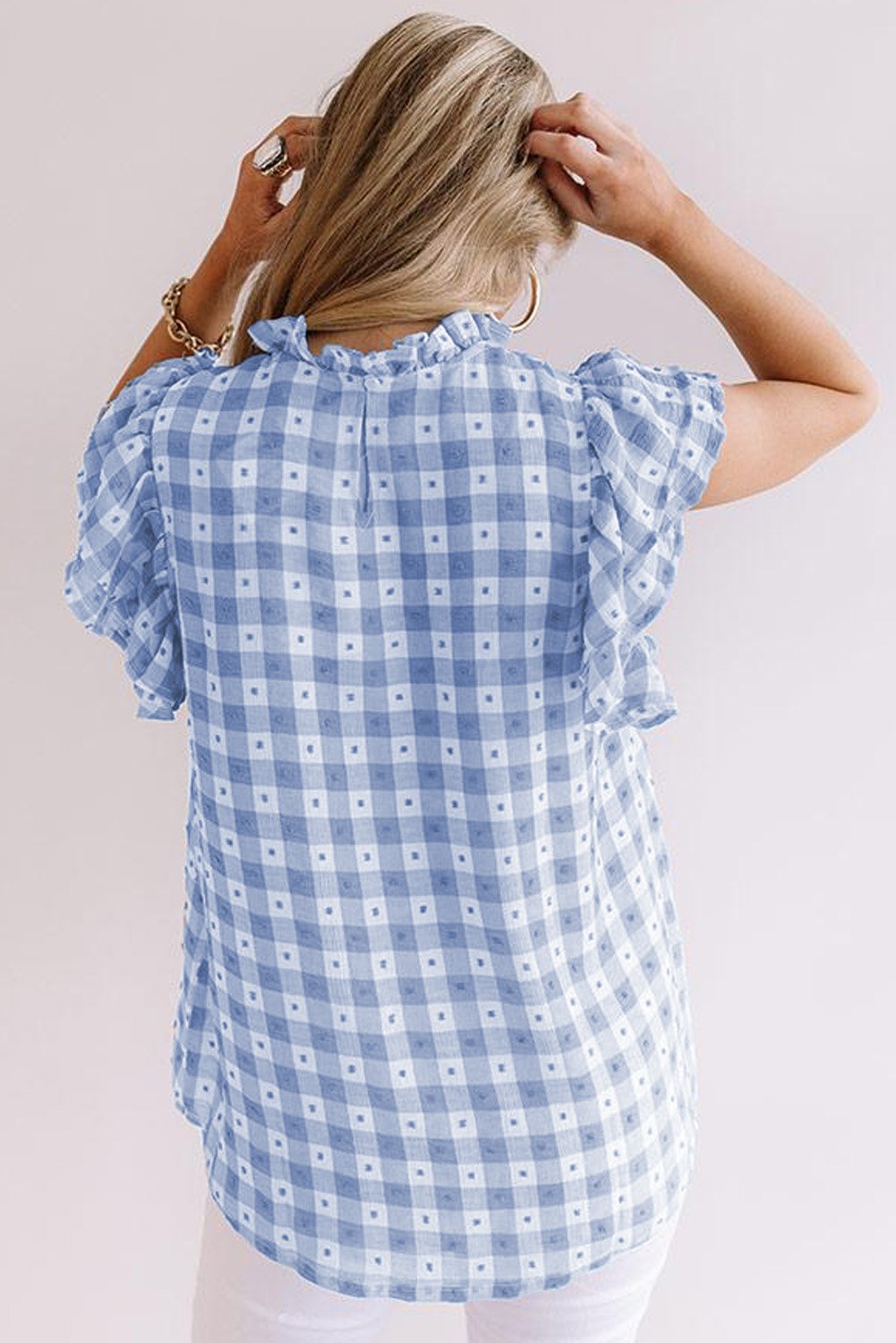 A stylish plaid ruffled short sleeves tee featuring a high rounded neckline and button closure at the back, perfect for casual wear.