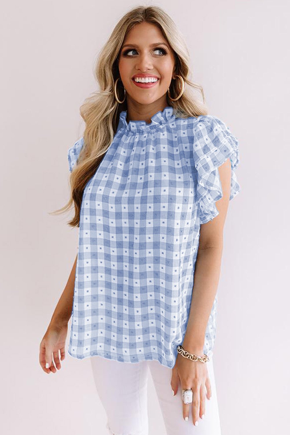 A stylish plaid ruffled short sleeves tee featuring a high rounded neckline and button closure at the back, perfect for casual wear.