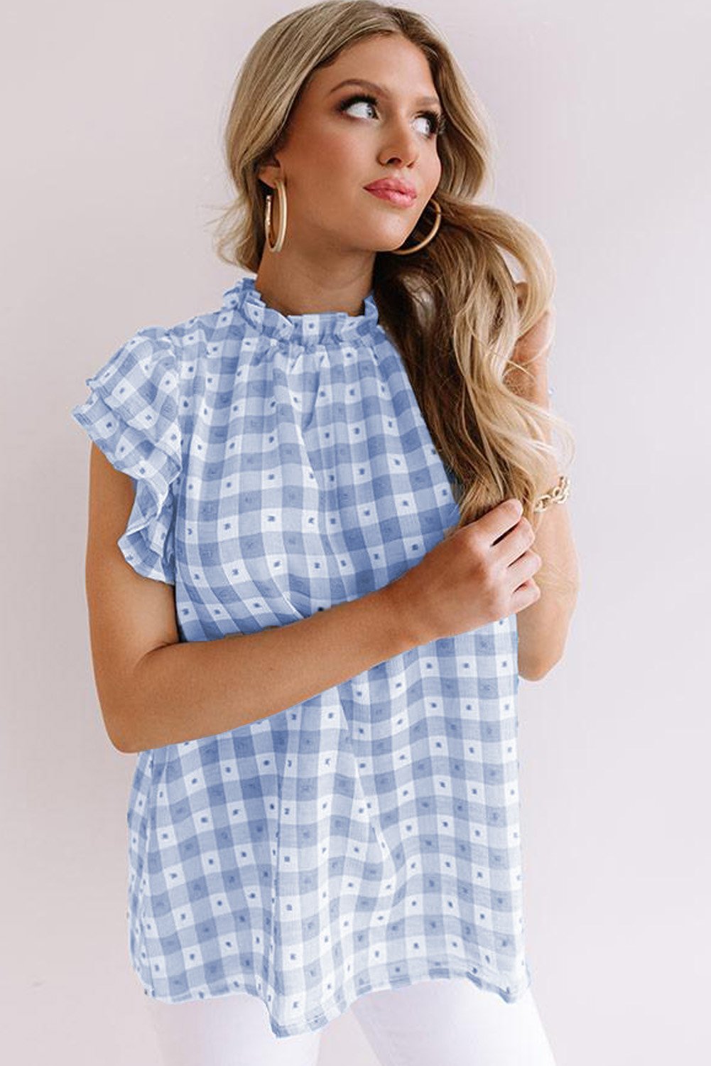 A stylish plaid ruffled short sleeves tee featuring a high rounded neckline and button closure at the back, perfect for casual wear.