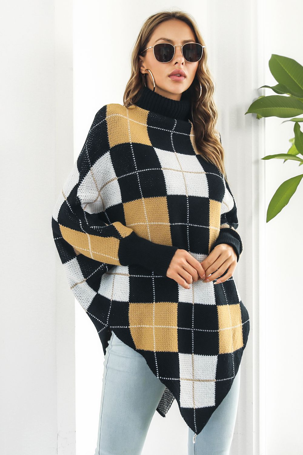 Plaid Turtleneck Dolman Sleeve Poncho in stylish plaid pattern, showcasing its cozy design and dolman sleeves.