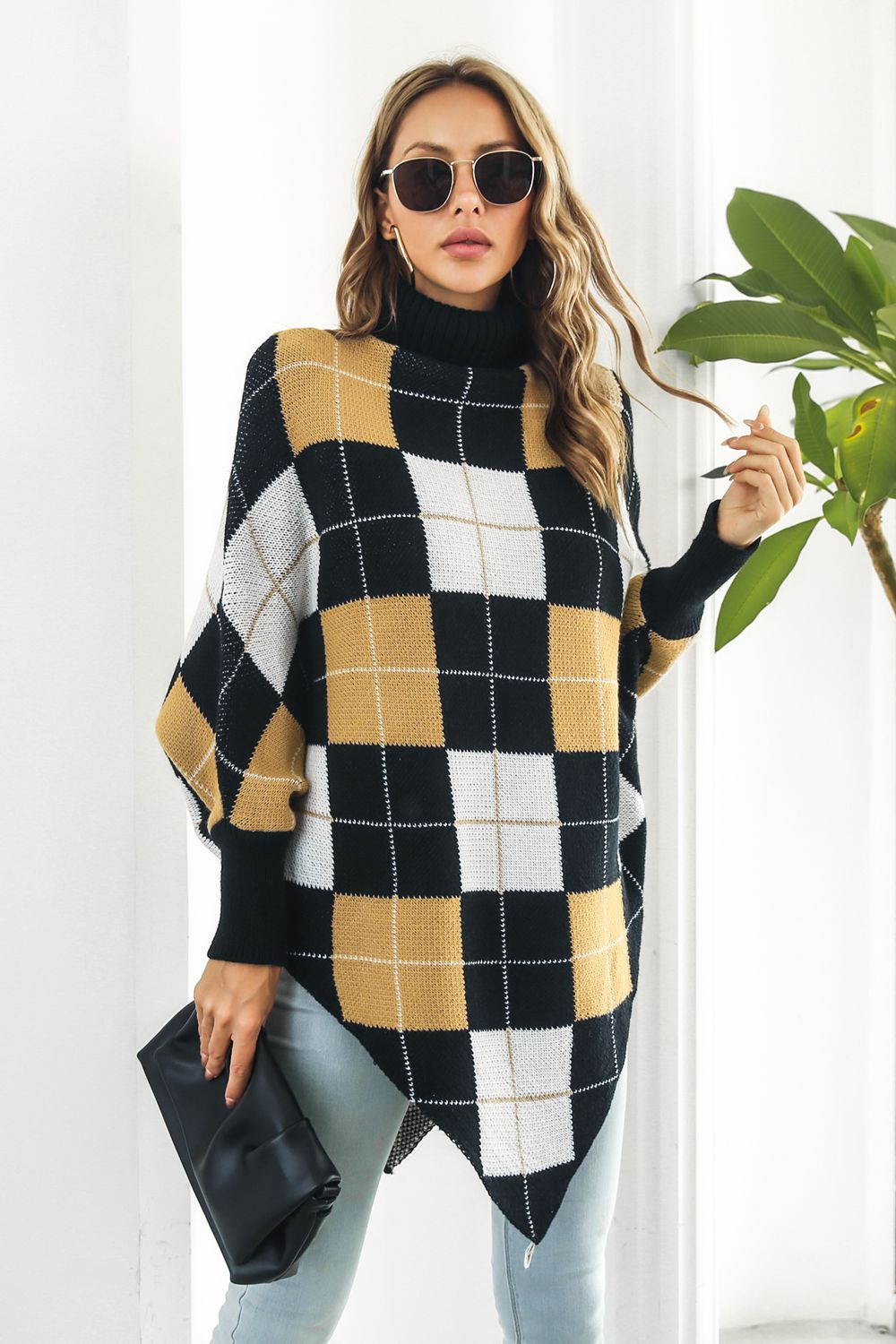 Plaid Turtleneck Dolman Sleeve Poncho in stylish plaid pattern, showcasing its cozy design and dolman sleeves.