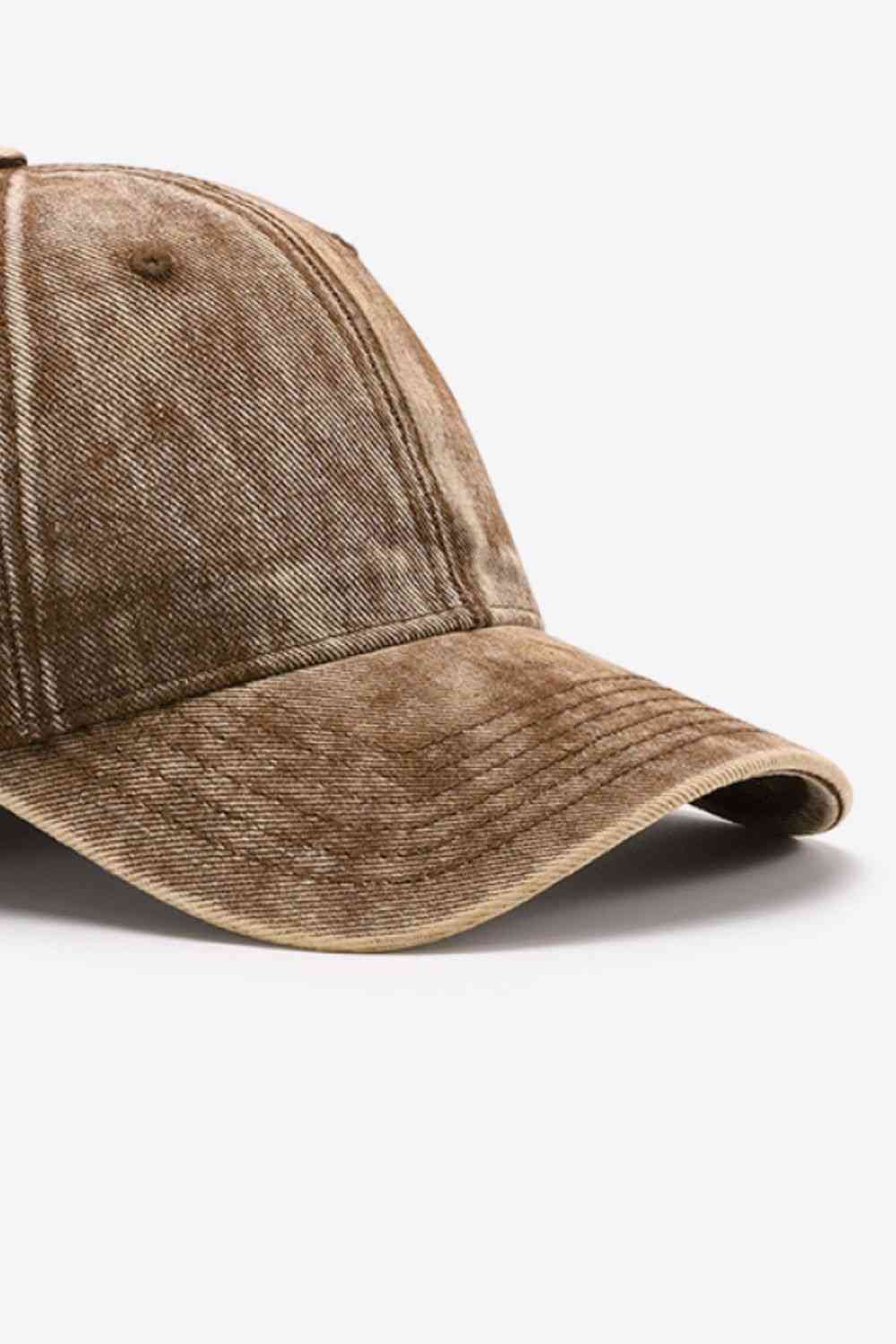 Plain adjustable baseball cap made of 100% cotton, featuring a solid pattern and adjustable strap for a comfortable fit.