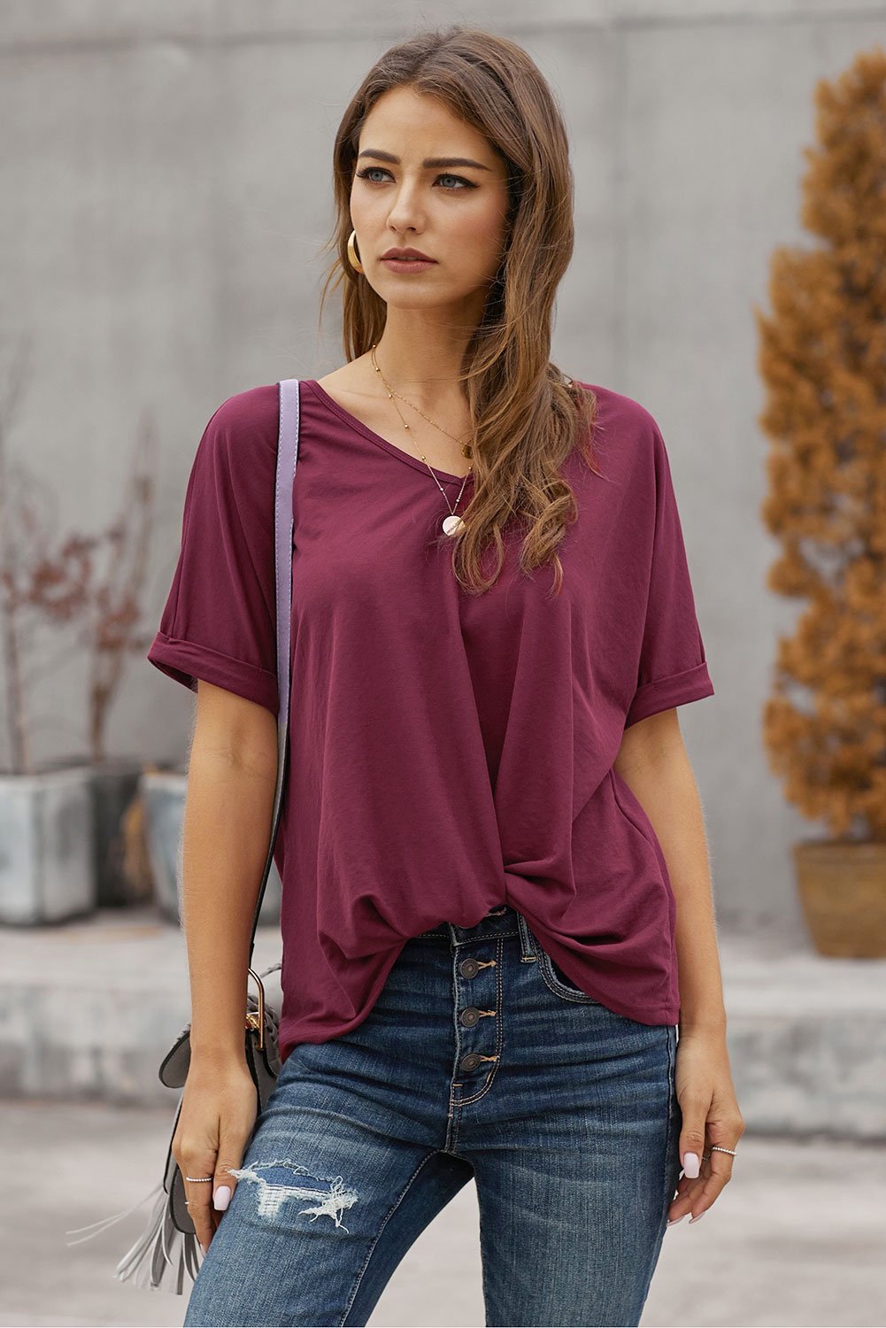 A stylish Plain Short Sleeve Twist Tee featuring a unique twist design, scoop neck, and kangaroo pouch, perfect for autumn wear.