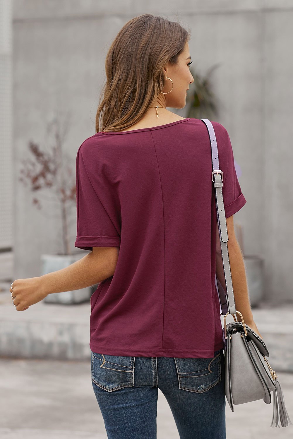 A stylish Plain Short Sleeve Twist Tee featuring a unique twist design, scoop neck, and kangaroo pouch, perfect for autumn wear.