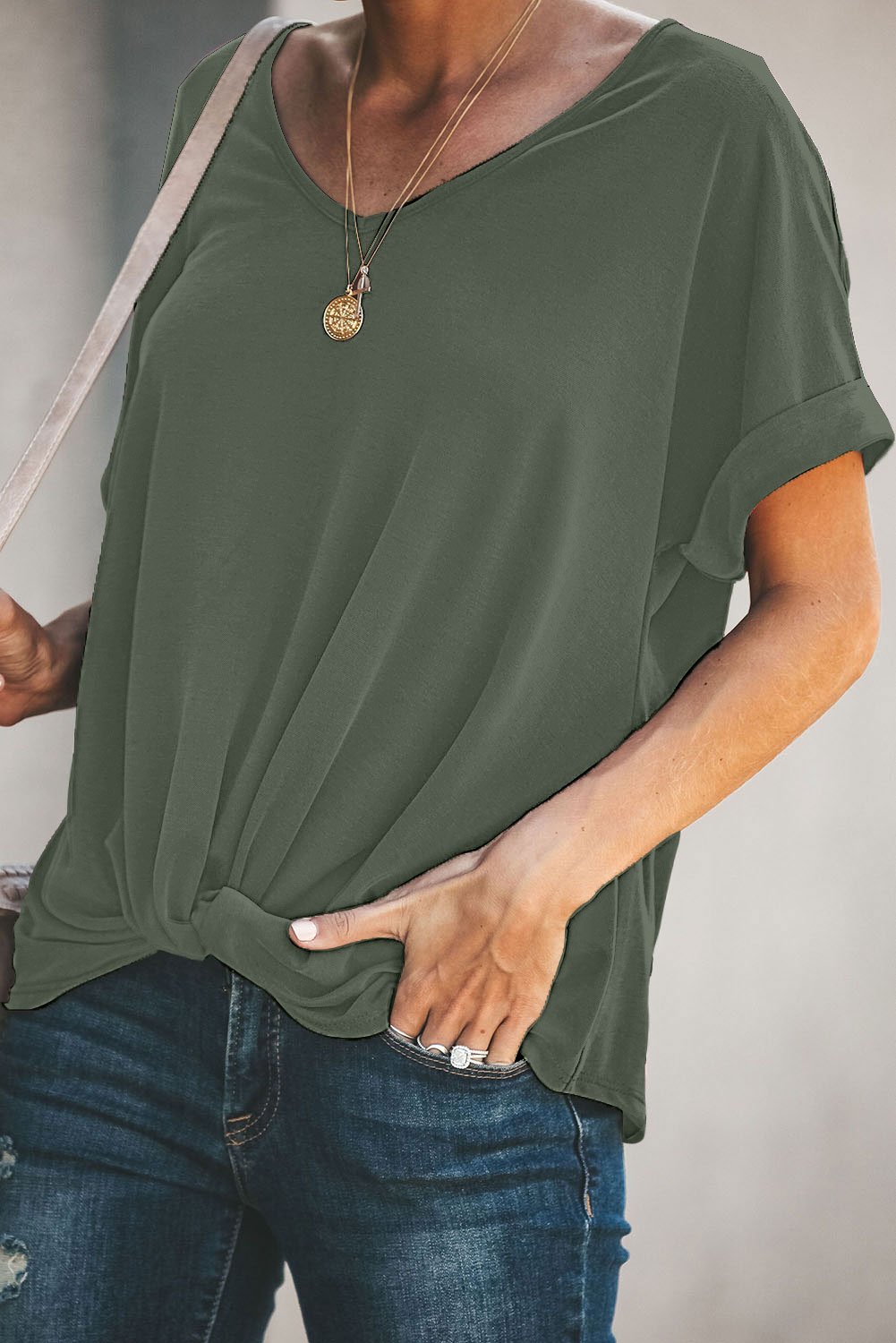 A stylish Plain Short Sleeve Twist Tee featuring a unique twist design, scoop neck, and kangaroo pouch, perfect for autumn wear.