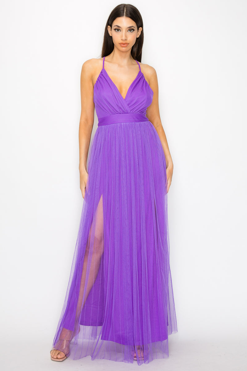 A stylish Pleated Mesh Slit Maxi Dress in purple featuring a pleated front slit, v-neckline, and adjustable cami straps, perfect for elegant occasions.