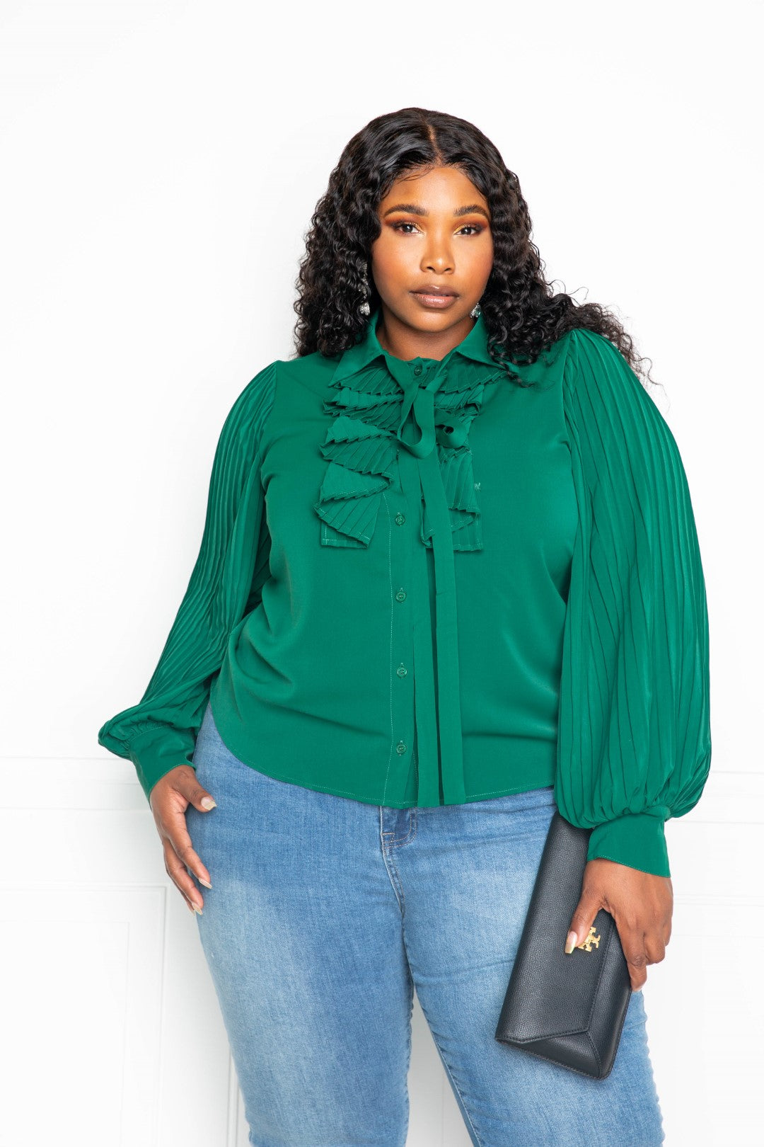 Forrest green pleated sleeve blouse with waterfall frill and bow detail, showcasing elegant design and comfortable fit.