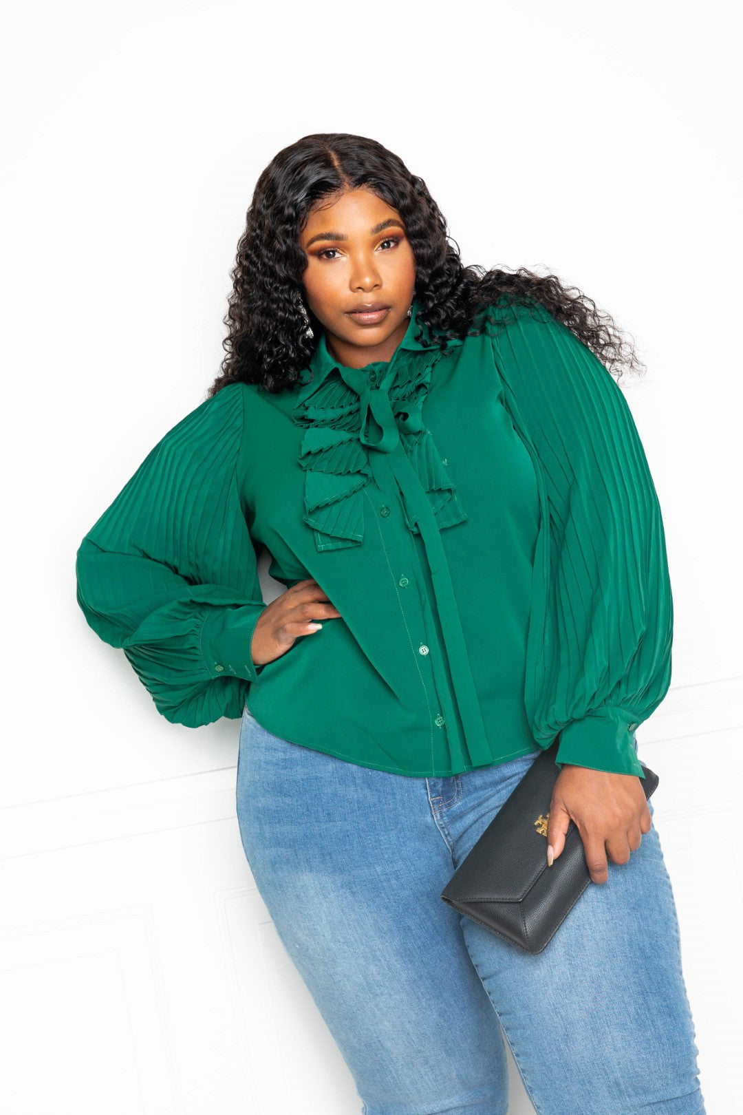 Forrest green pleated sleeve blouse with waterfall frill and bow detail, showcasing elegant design and comfortable fit.