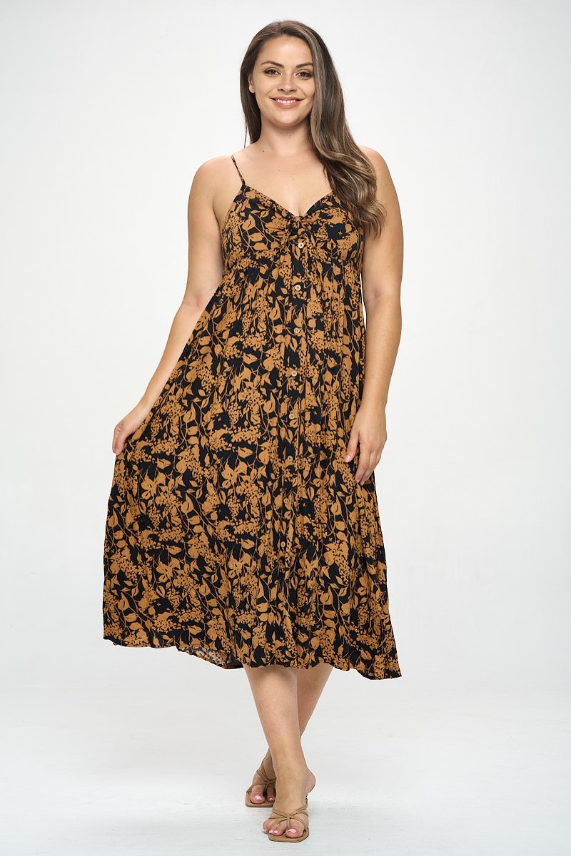 A stylish plus-size maxi dress featuring a botanical print and a front tie detail, perfect for various occasions.