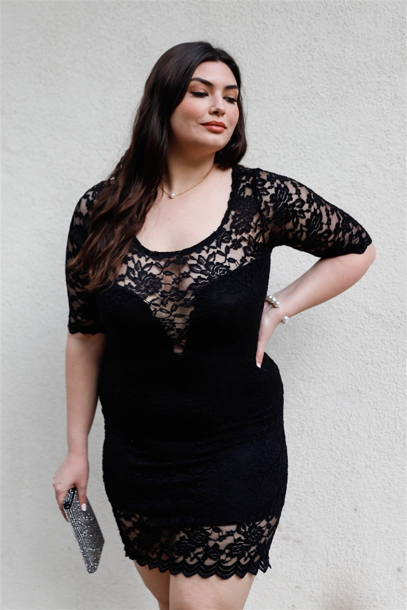 A stylish Plus Lace Mini Dress featuring a solid black color, lace material, midi sleeves, and a round neckline, perfect for plus-size women.