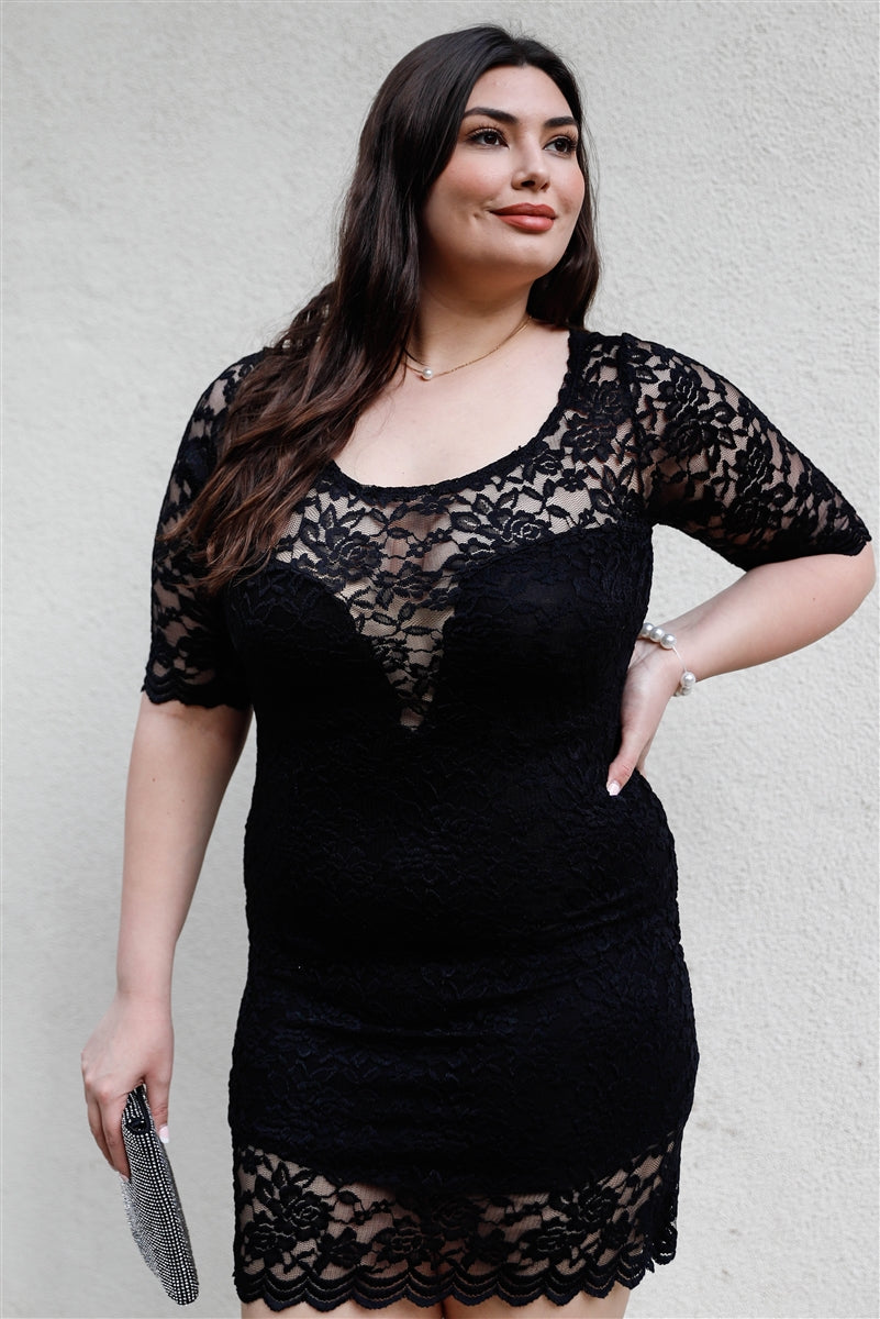 A stylish Plus Lace Mini Dress featuring a solid black color, lace material, midi sleeves, and a round neckline, perfect for plus-size women.