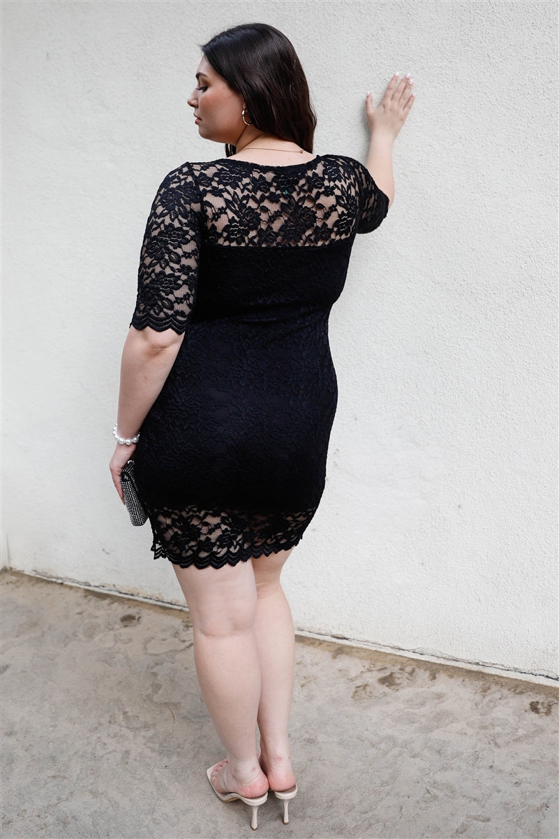 A stylish Plus Lace Mini Dress featuring a solid black color, lace material, midi sleeves, and a round neckline, perfect for plus-size women.