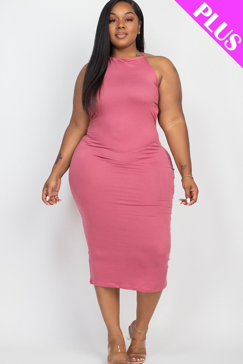 A stylish plus-size woman wearing a dark mauve crisscross open back maxi dress, showcasing its elegant design and comfortable fit.