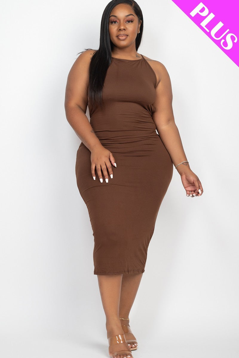 A stylish plus size woman wearing a coffee-colored open back crisscross maxi dress, showcasing its elegant design and comfortable fit.