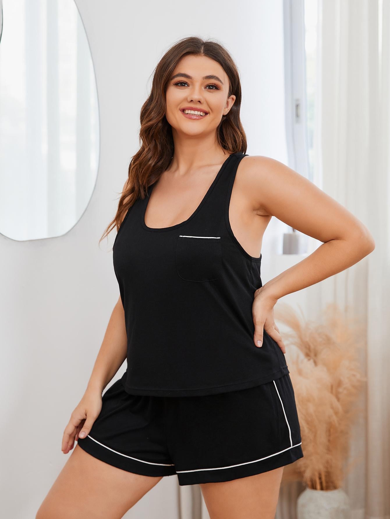 Plus size lounge set featuring a contrast piping racerback tank top and shorts, designed for comfort and style.