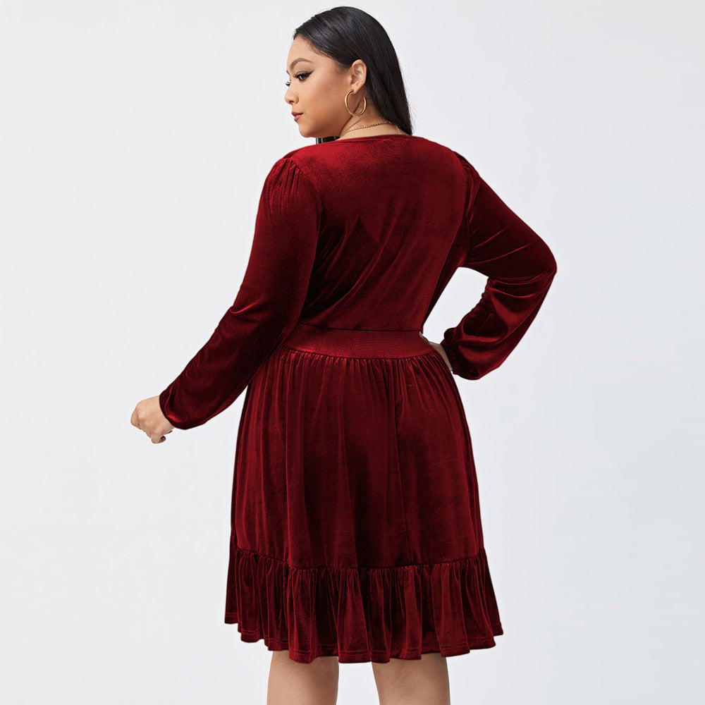 Plus size deep V long sleeve velvet dress with ruffle hem, showcasing elegant design and soft fabric.