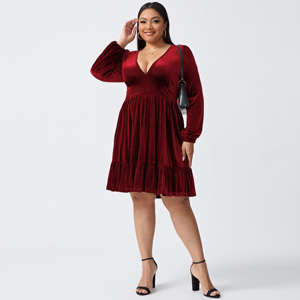 Plus size deep V long sleeve velvet dress with ruffle hem, showcasing elegant design and soft fabric.