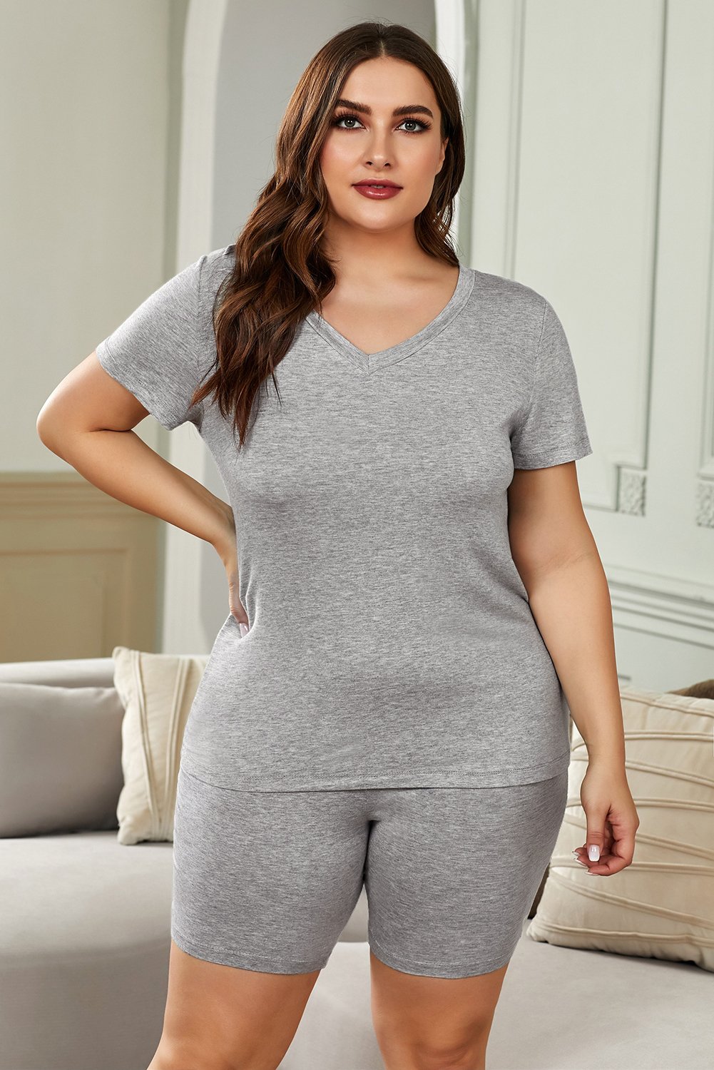 Plus Size V Neck T-shirt and Shorts Loungewear set featuring a soft cotton fabric, short sleeves, and elastic waistband shorts.