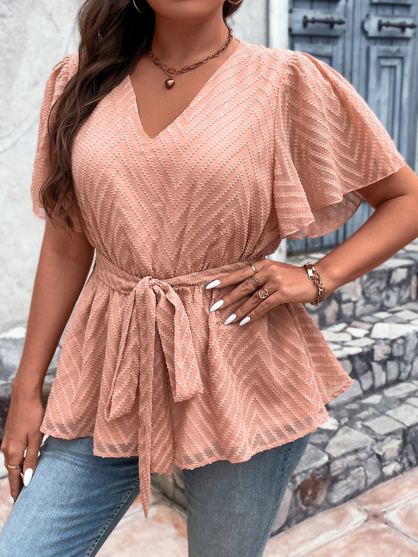 Plus Size V-Neck Flutter Sleeve Tie Waist Blouse in solid color, featuring flutter sleeves and a tie waist design.