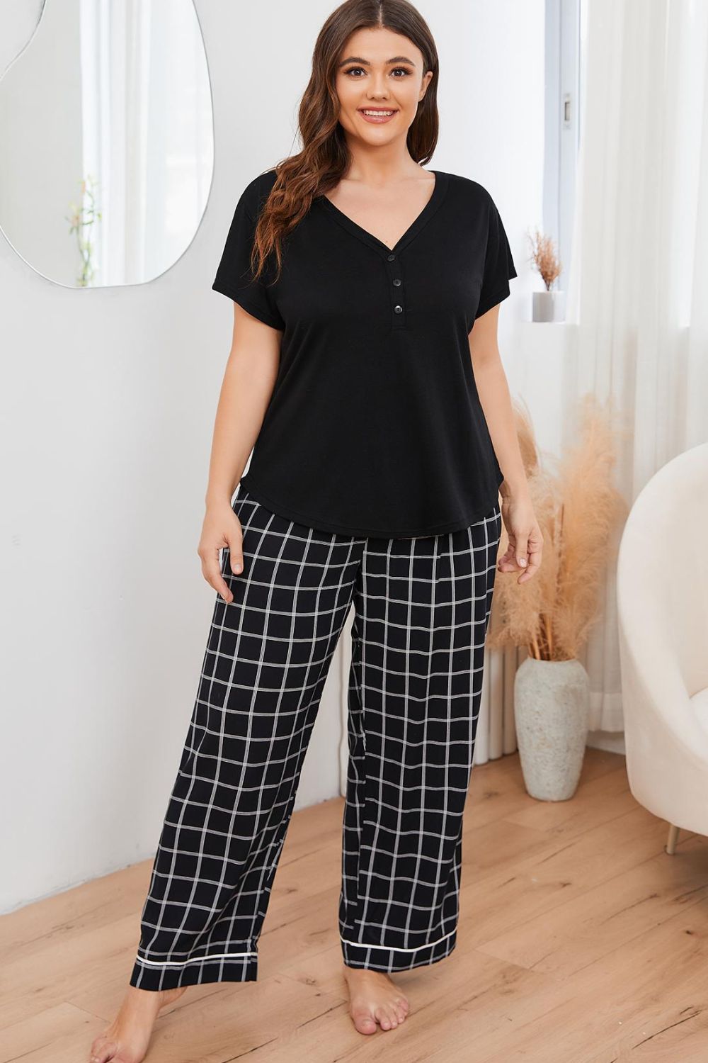 A stylish plus size lounge set featuring a V-neck top and plaid pants, perfect for comfort and casual outings.