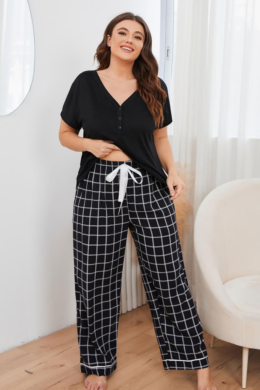 A stylish plus size lounge set featuring a V-neck top and plaid pants, perfect for comfort and casual outings.