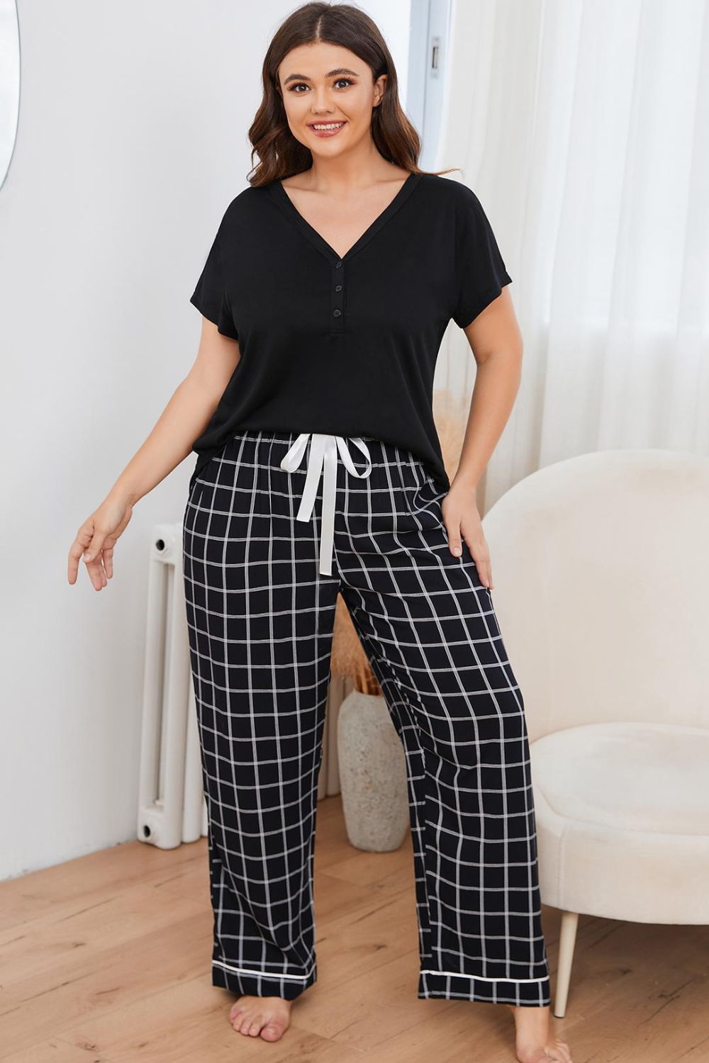 A stylish plus size lounge set featuring a V-neck top and plaid pants, perfect for comfort and casual outings.