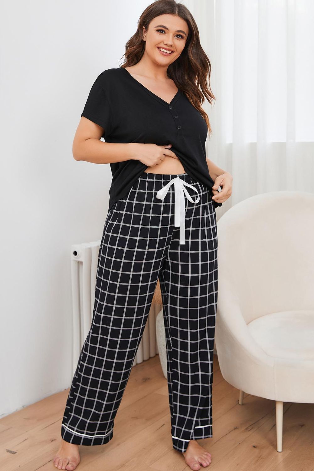 A stylish plus size lounge set featuring a V-neck top and plaid pants, perfect for comfort and casual outings.