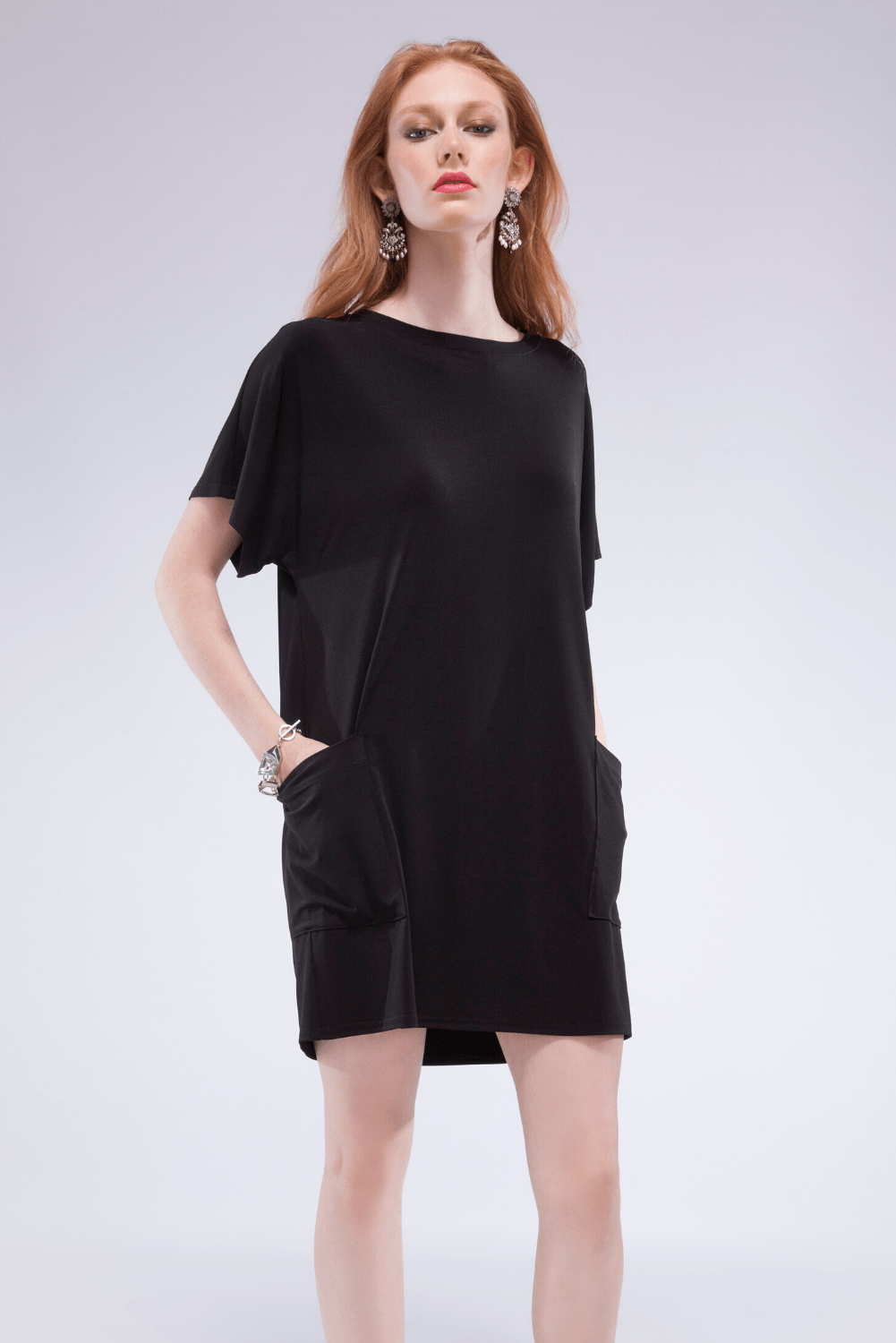 A stylish Pocket Shift Dress made from soft bamboo fabric, featuring a relaxed fit, scoop neck, and front pockets, perfect for summer wear.