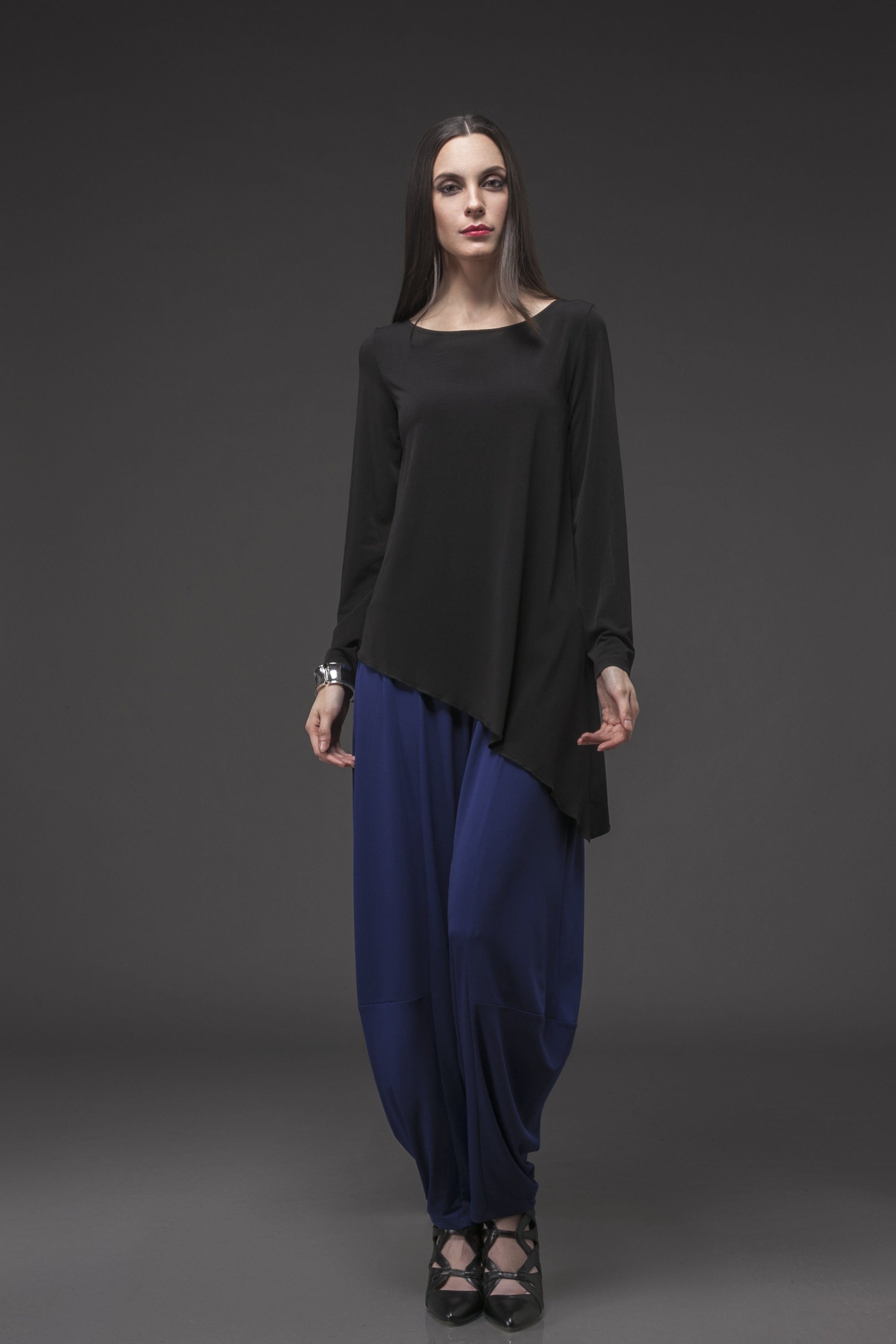 A stylish Point Full Sleeve Top featuring a scoop neck, full flare sleeves, and a pointed asymmetrical hem in a versatile color.