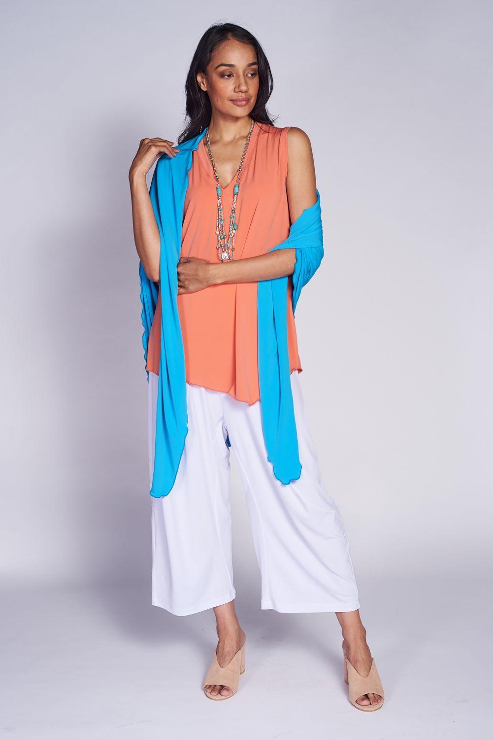 A stylish Point Shawl made from 94% polyester and 6% spandex, showcasing its elegant design and versatile colors.