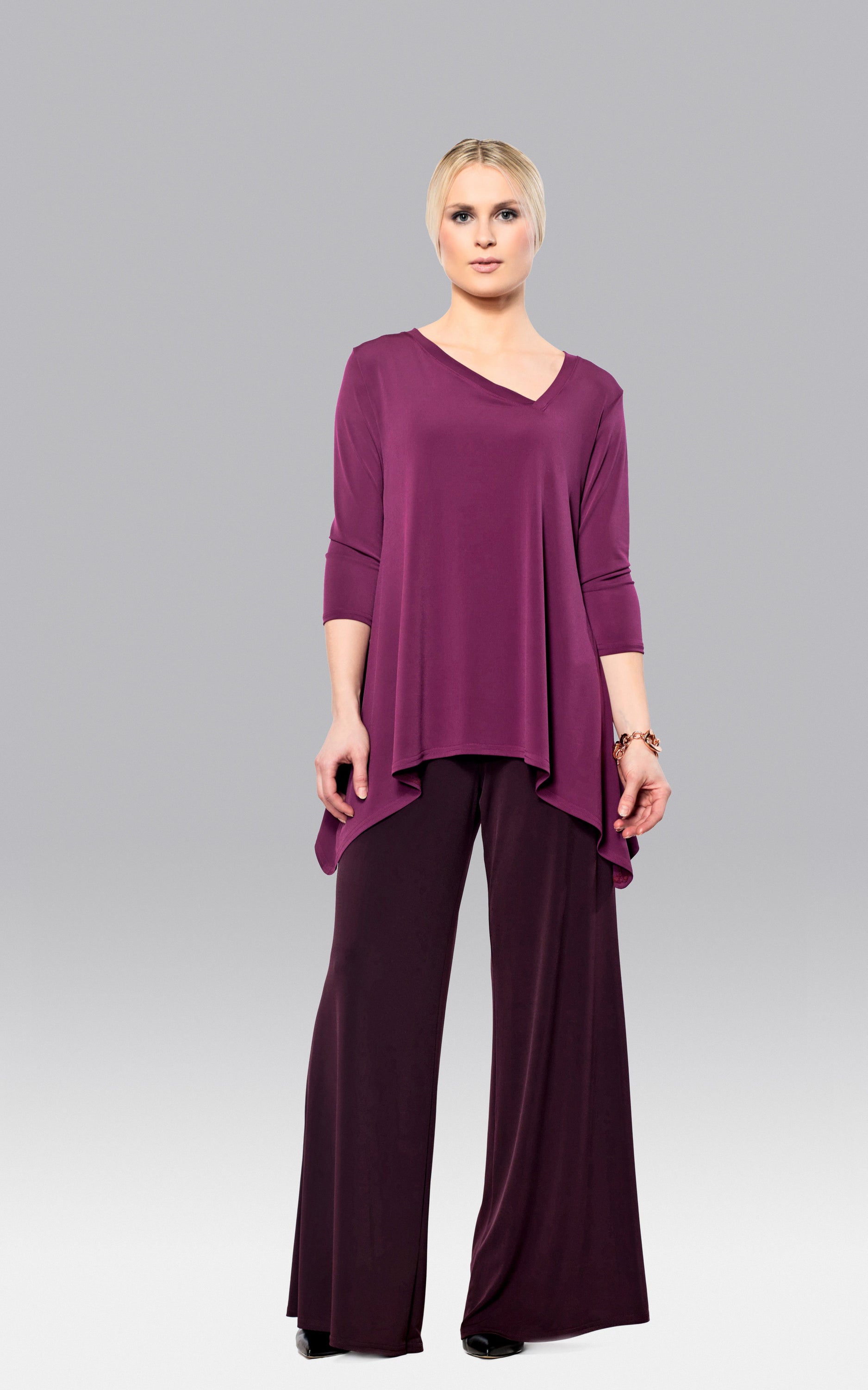 Stylish Pointed Top in Berry featuring an asymmetrical neckline and 3/4 sleeves, perfect for versatile outfits.