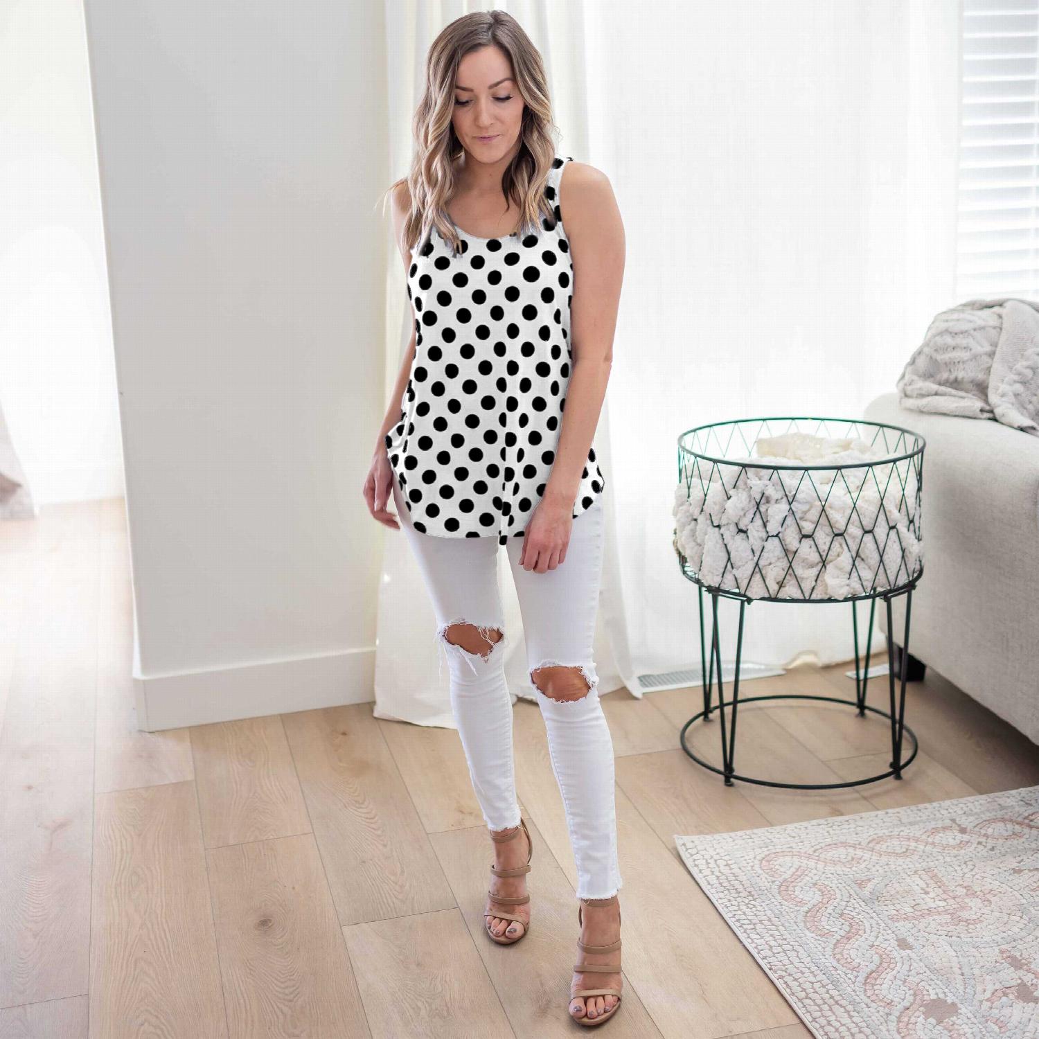 A stylish sleeveless top featuring a playful polka dot design, round neckline, and round hem, perfect for casual wear.