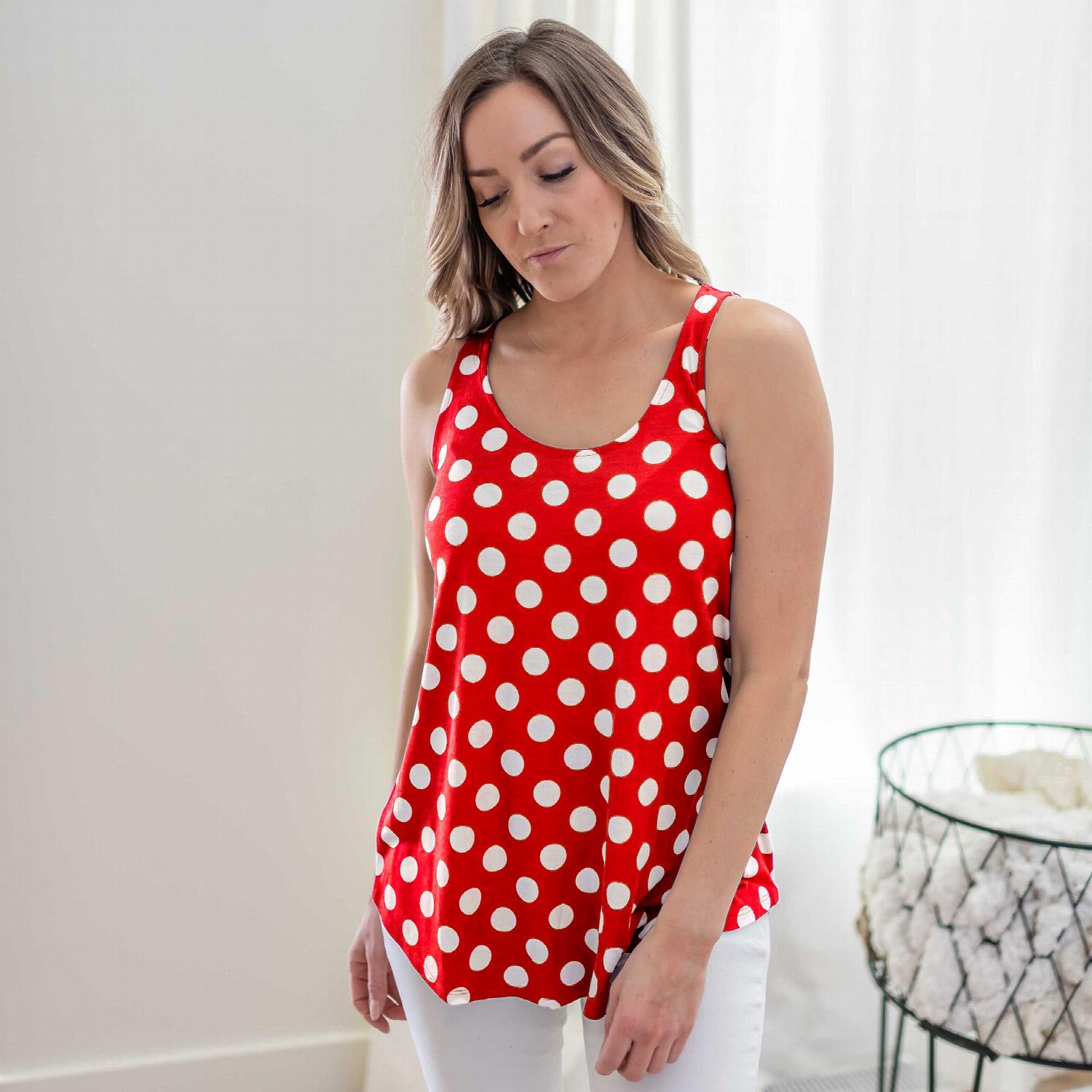 A stylish sleeveless top featuring a playful polka dot design, round neckline, and round hem, perfect for casual wear.