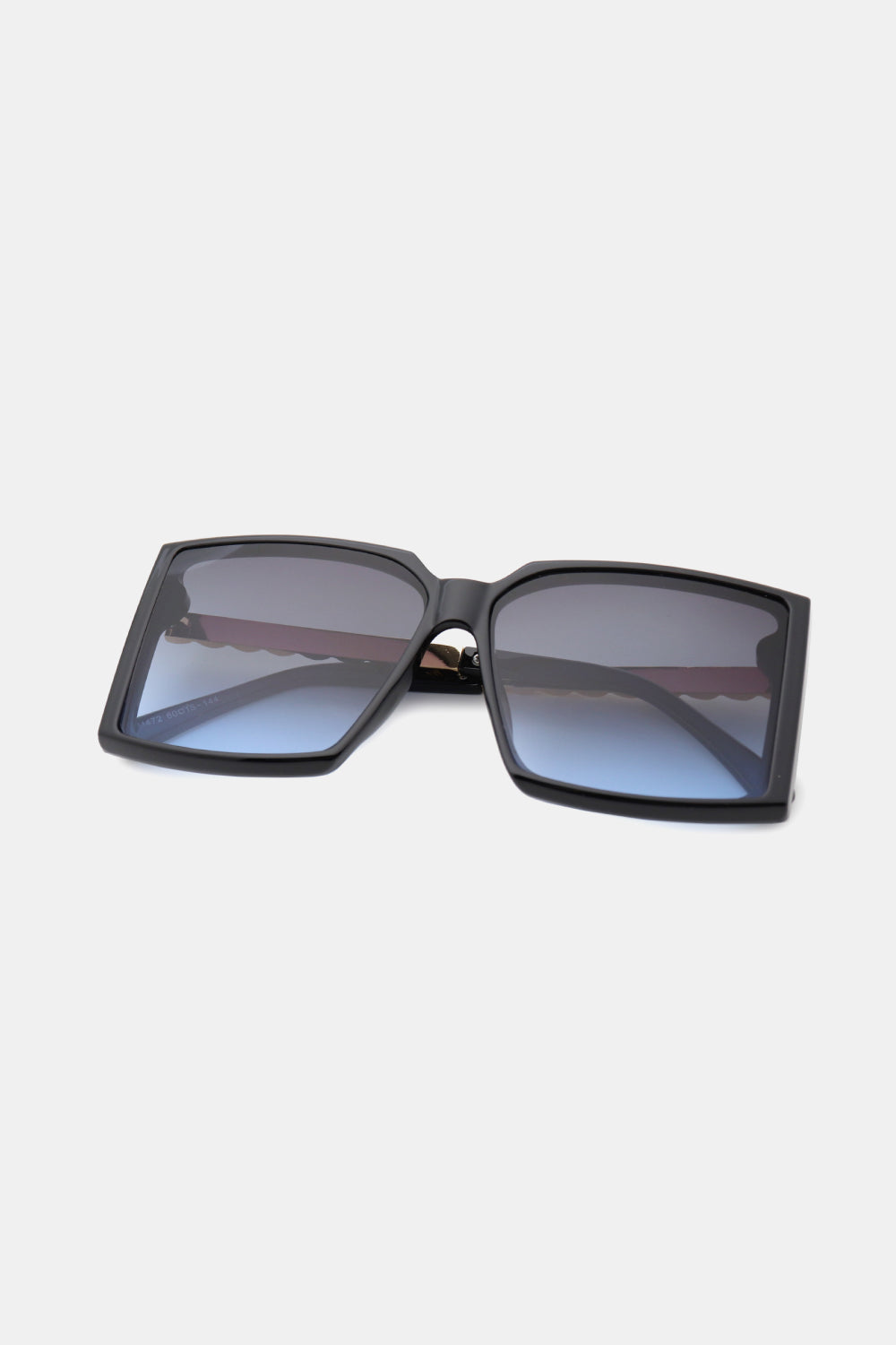 A pair of stylish square sunglasses with a polycarbonate frame and UV400 lenses, displayed in a protective case.