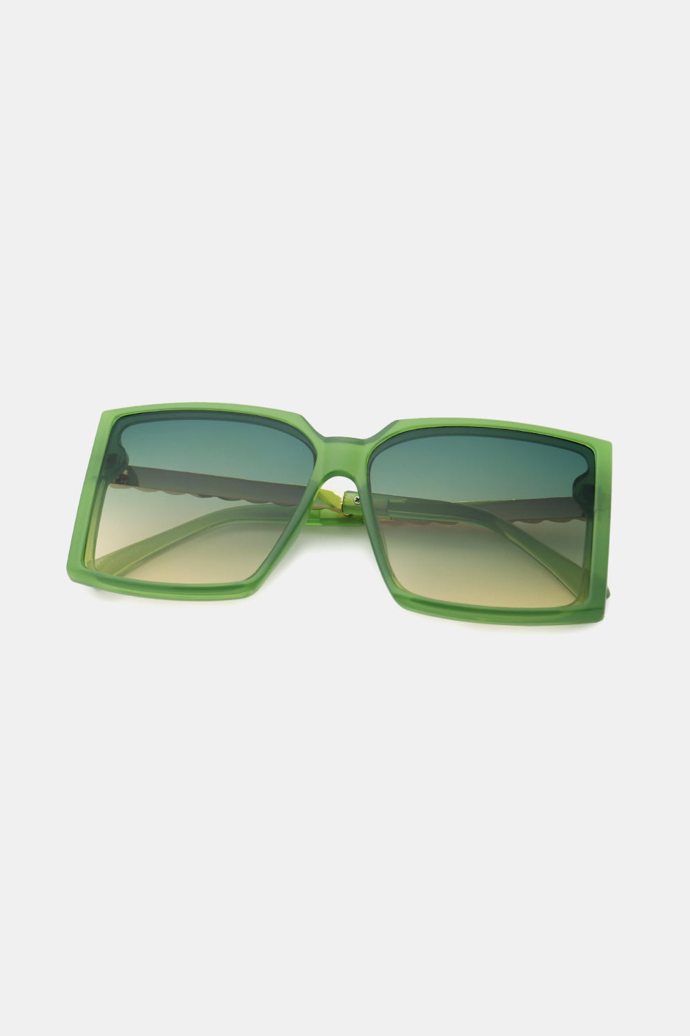 A pair of stylish square sunglasses with a polycarbonate frame and UV400 lenses, displayed in a protective case.