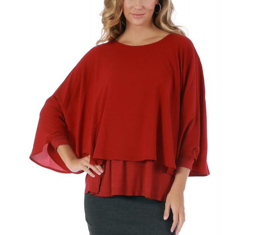 Chic Poncho Top with Boatneck featuring wrist cuffs and sleeveless tank underneath, perfect for casual wear.