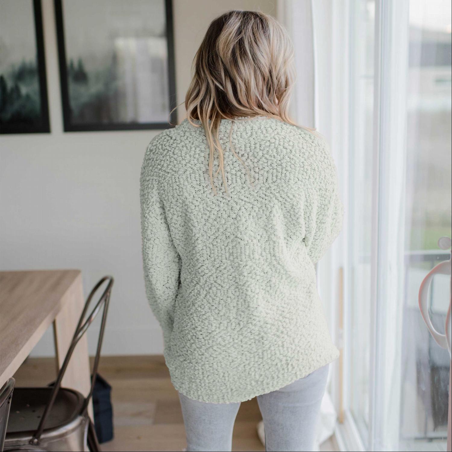 A cozy Popcorn Knit Bubble Sleeve Sweater featuring textured fabric, balloon sleeves, and a scoop neck, perfect for fall fashion.