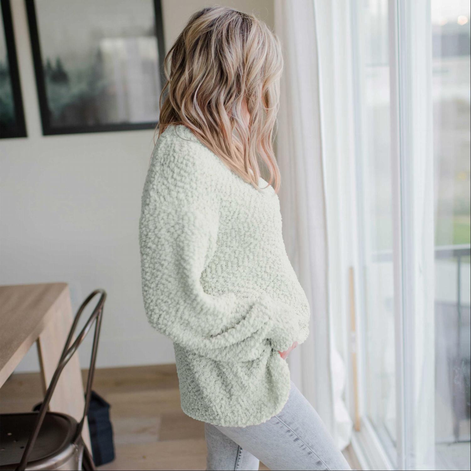 A cozy Popcorn Knit Bubble Sleeve Sweater featuring textured fabric, balloon sleeves, and a scoop neck, perfect for fall fashion.