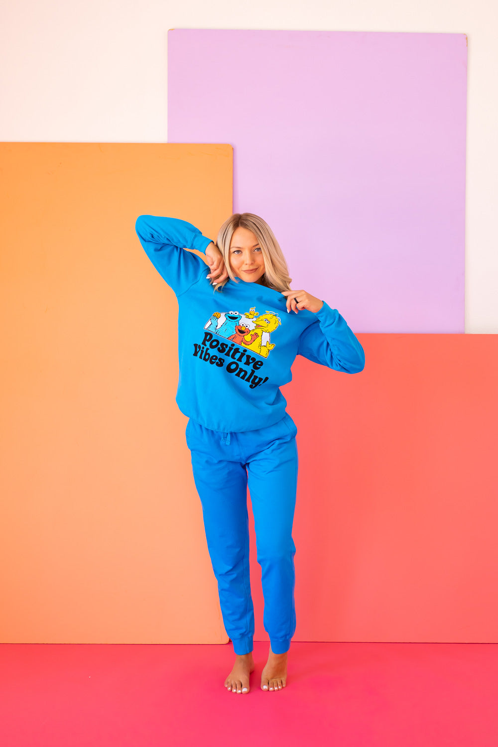 Positive Vibes Sesame Sweatshirt in blue featuring iconic Sesame Street characters, made from 100% upcycled cotton.