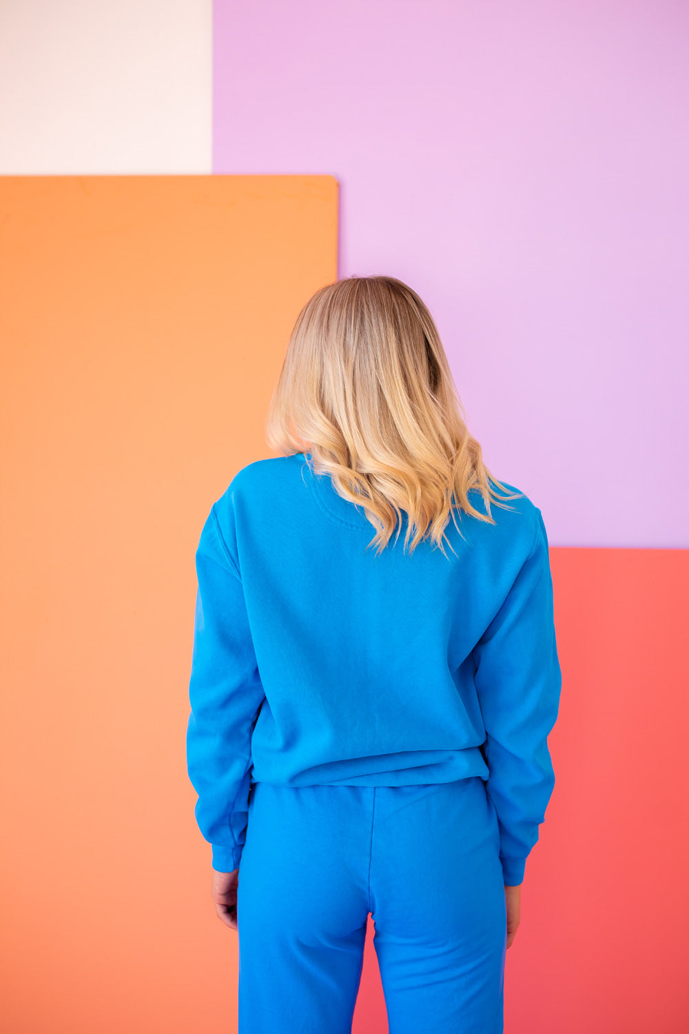 Positive Vibes Sesame Sweatshirt in blue featuring iconic Sesame Street characters, made from 100% upcycled cotton.