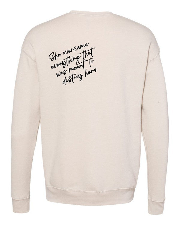 A stylish plus-size sweatshirt featuring the empowering text 'PowHerful' on the front and 'She Overcame Everything That Was Meant to Destroy Her' on the back.