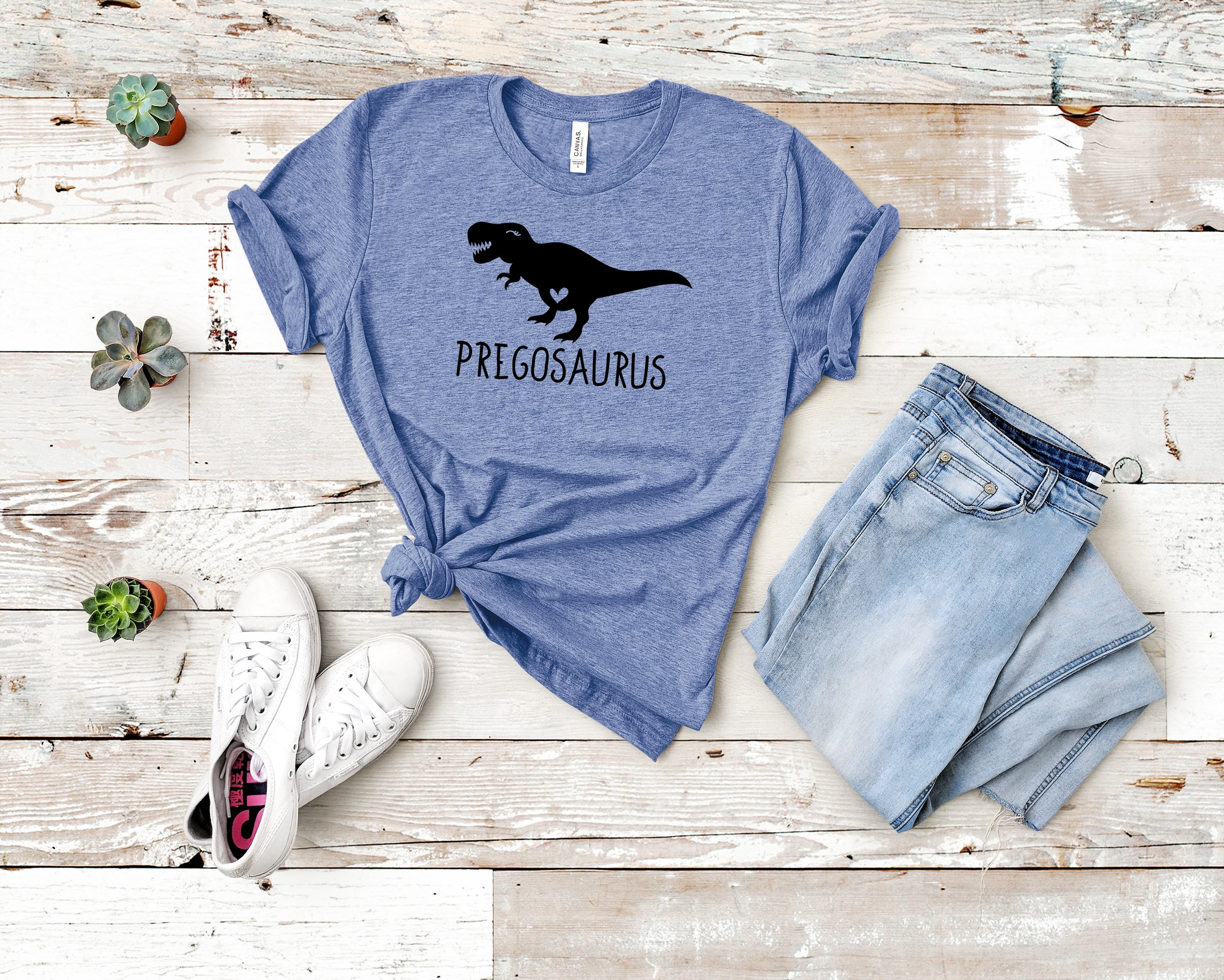 Pregosaurus Dinosaur Pregnancy Tee featuring a playful dinosaur graphic on a comfortable unisex shirt.