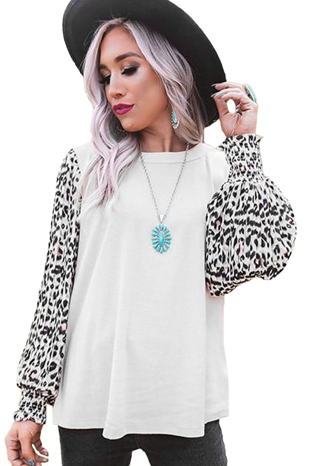 A stylish Print Crew Neck Puff Sleeve Top featuring a bold leopard print pattern in black and light neutral tones, with smocked cuffs and a keyhole back.