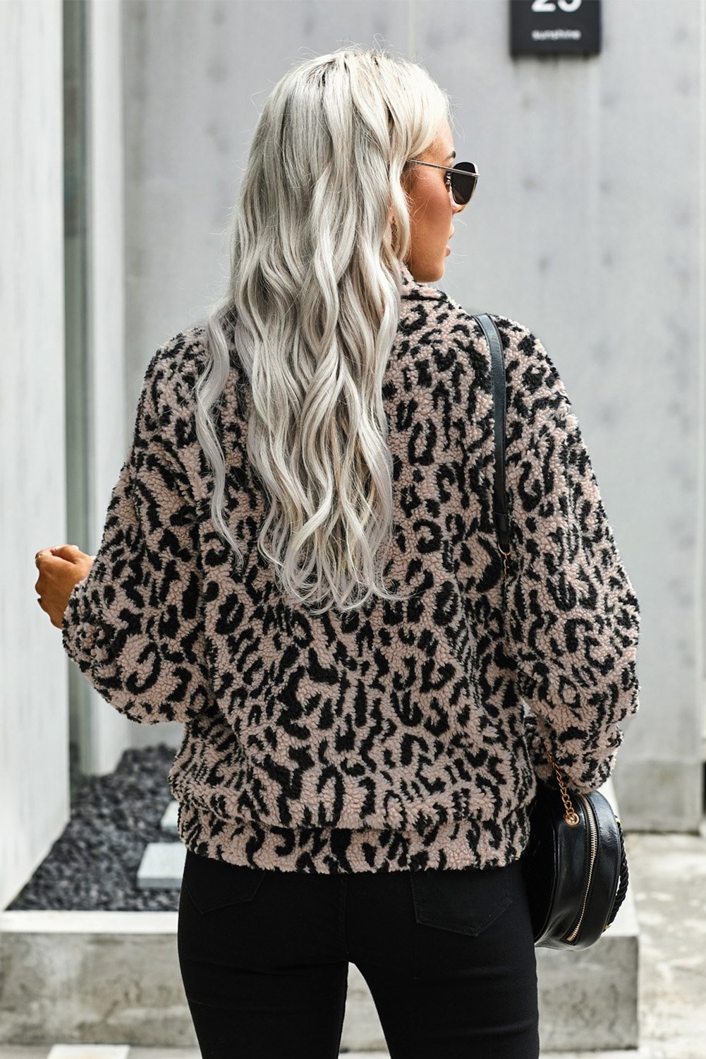 A stylish Print Sherpa Jacket Coat featuring soft sherpa fabric with plaid and leopard prints, open front design, and two side pockets.